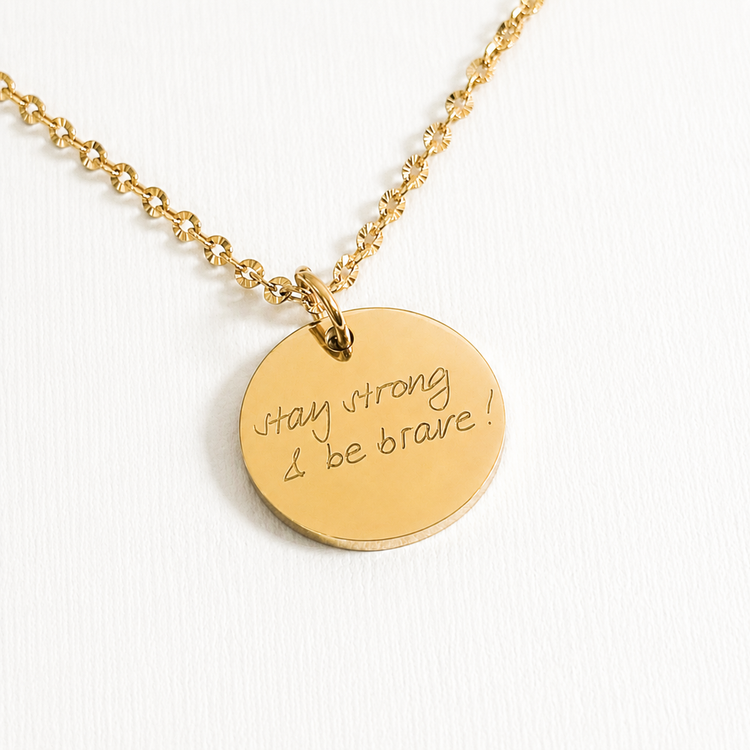Personalised Gold necklace with an engraved round pendant engraved with 'Stay strong be brave'