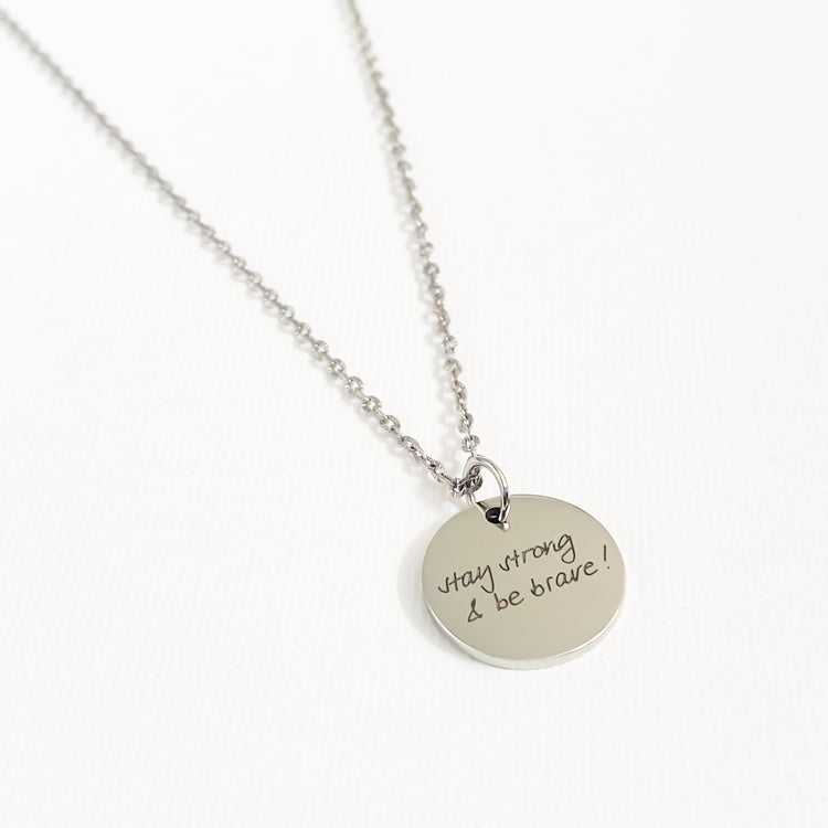 Custom Silver necklace with an engraved round pendant 