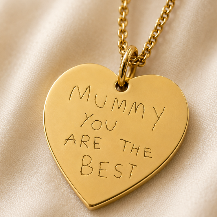Custom gold heart-shaped pendant necklace engraved with the words 'Mummy YOU ARE THE BEST' in a handwritten font.