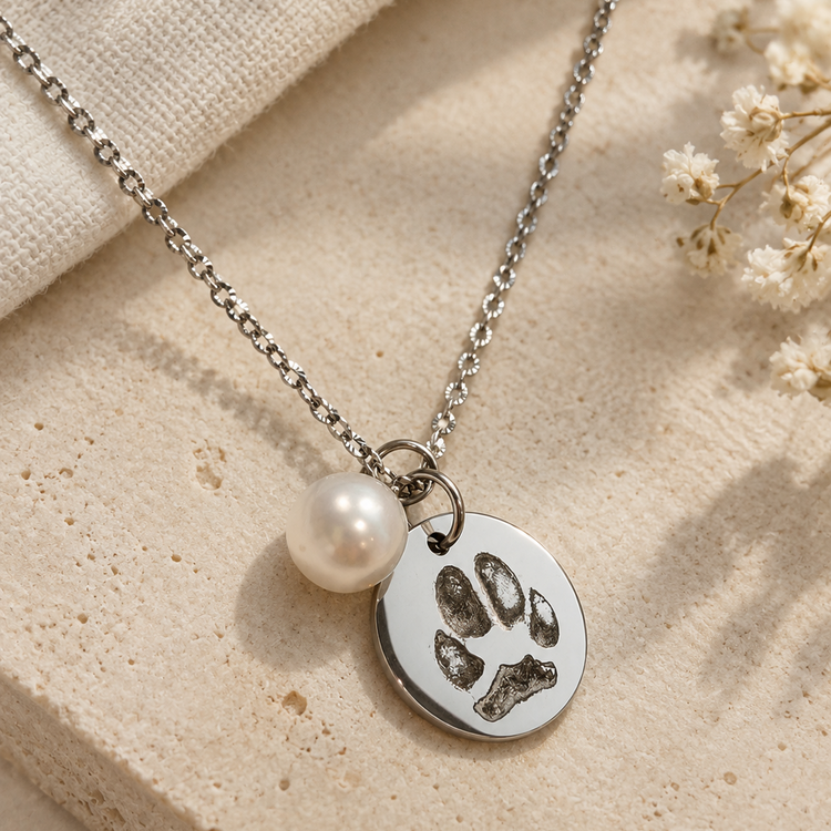Silver pet paw print necklace with an optional natural pearl charm