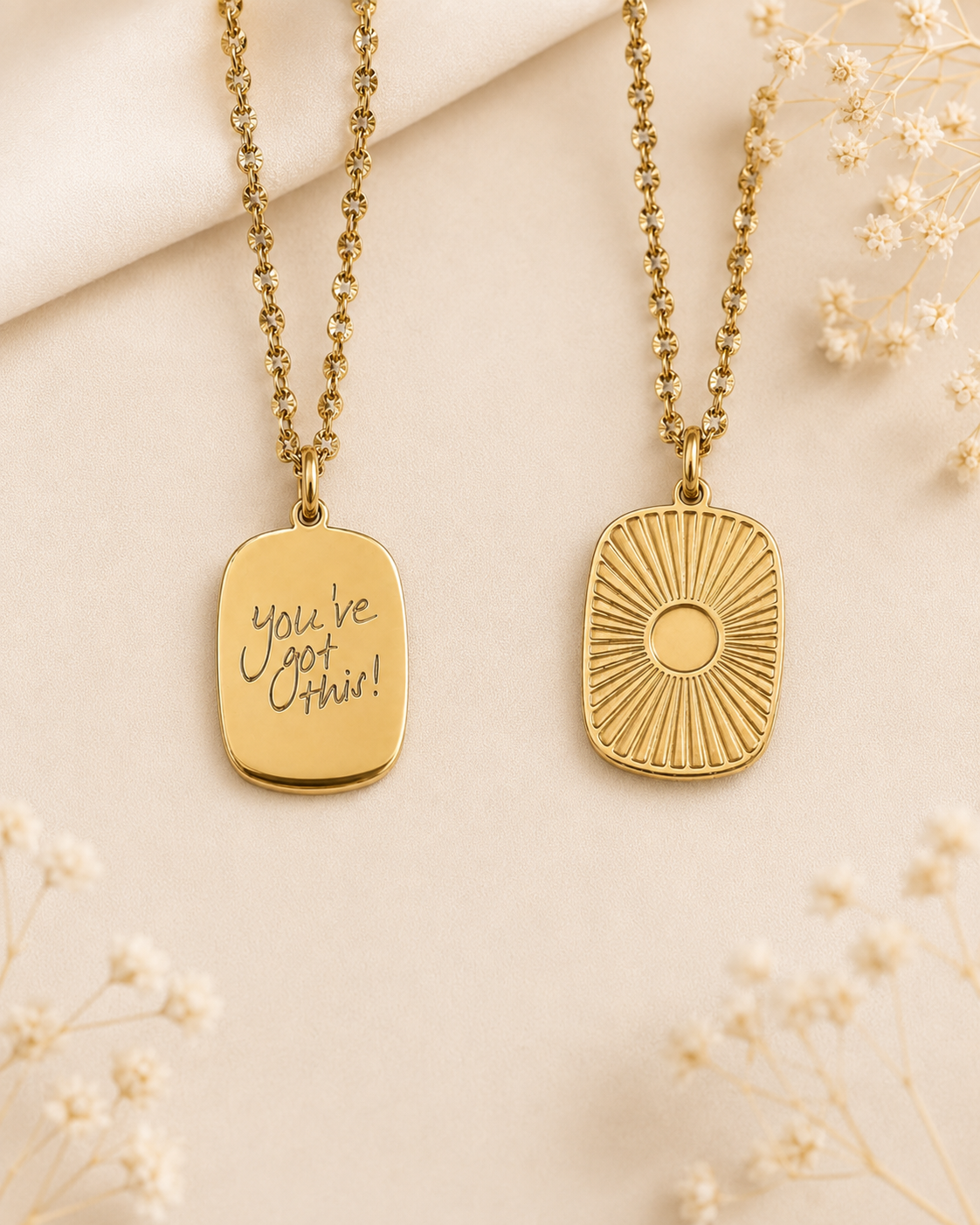 Gold medallion necklaces showing the engraved handwriting side and the sunburst side